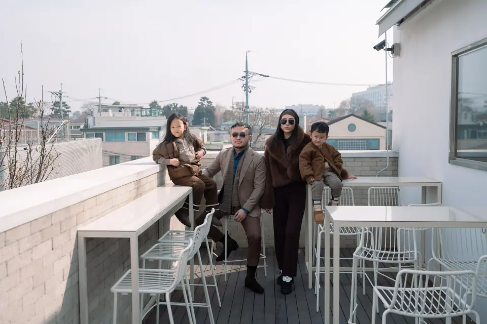 A family on a rooftop terrace